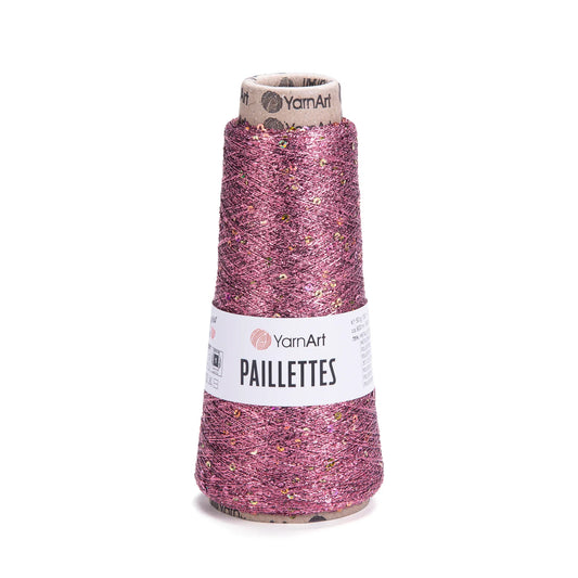 Cono de hilado YarnArt Paillettes fucsia brillante con lentejuelas doradas y plateadas, ideal para tejidos decorativos.