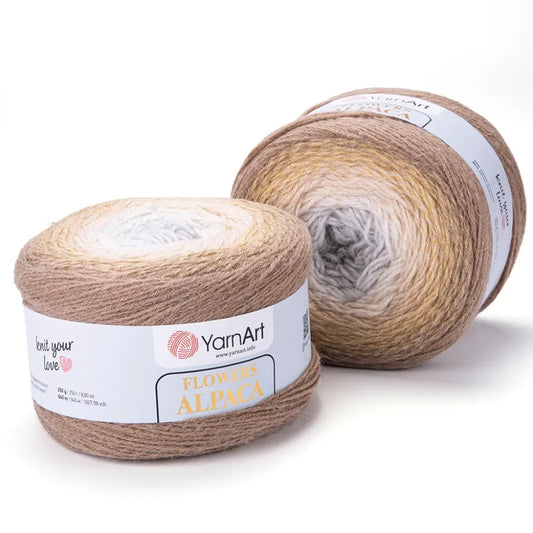 Dos ovillos YarnArt Flowers Alpaca de lana degradada en tonos tierra, beige y blanco, ideales para tejer.