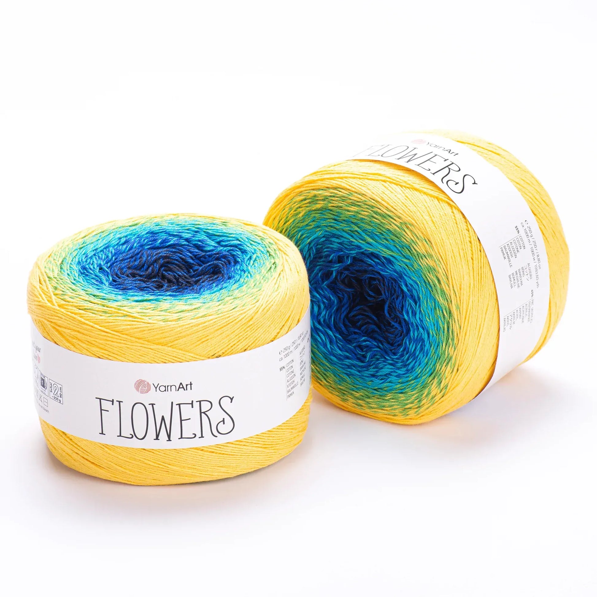 Dos ovillos YarnArt Flowers degradé de amarillo a azul, mezcla de algodón y acrílico, ideales para tejer. Textura suave.