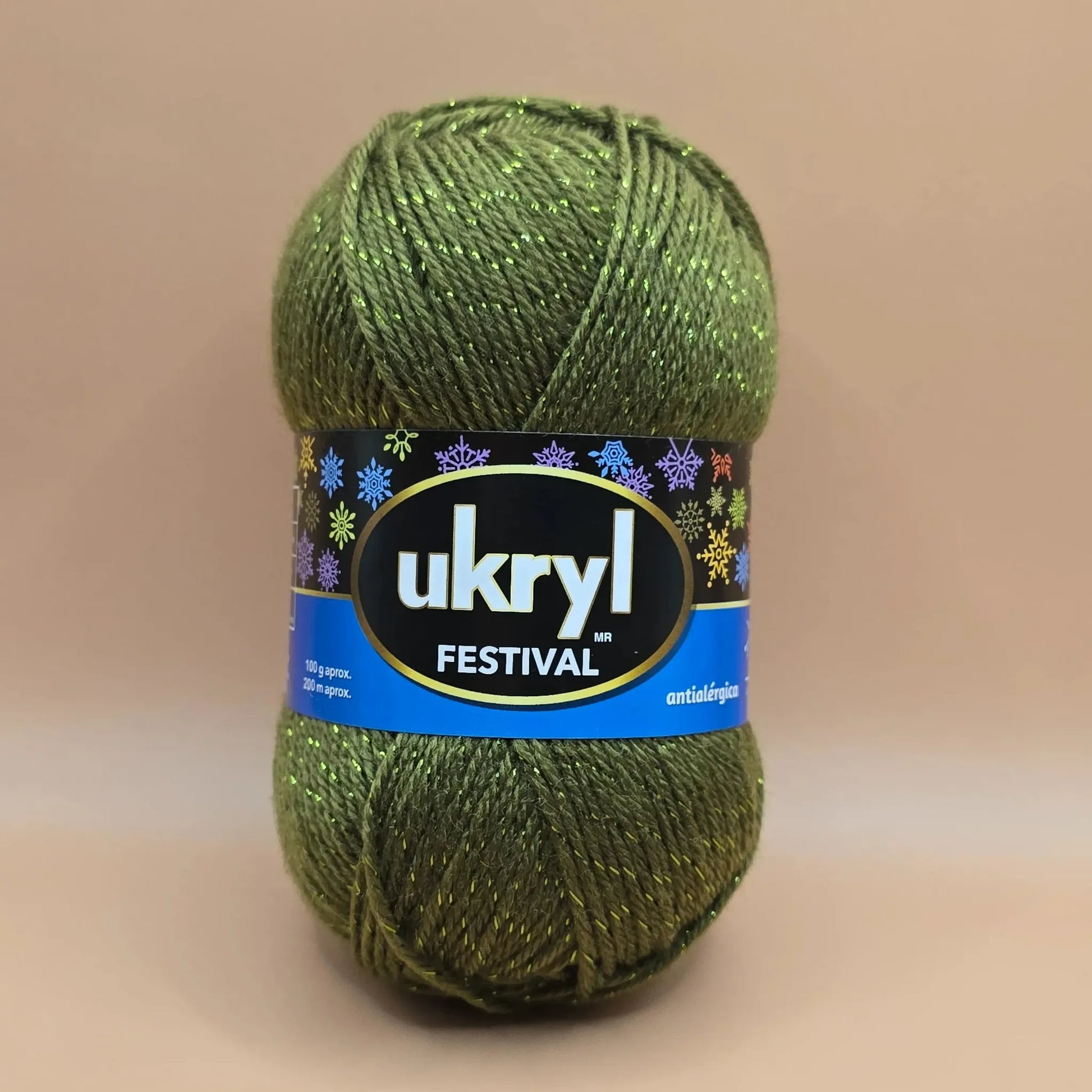 Ovillo de lana Ukryl Festival verde oscuro con brillos dorados (lurex), antialérgico, ideal para tejer prendas y decoraciones festivas.