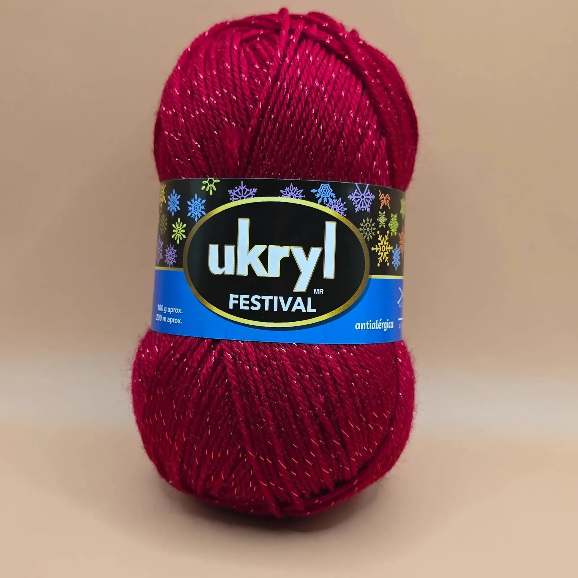 Ovillo de lana Ukryl Festival rojo brillante con hebras de lurex, 94% acrílico antialérgico, ideal para tejidos.